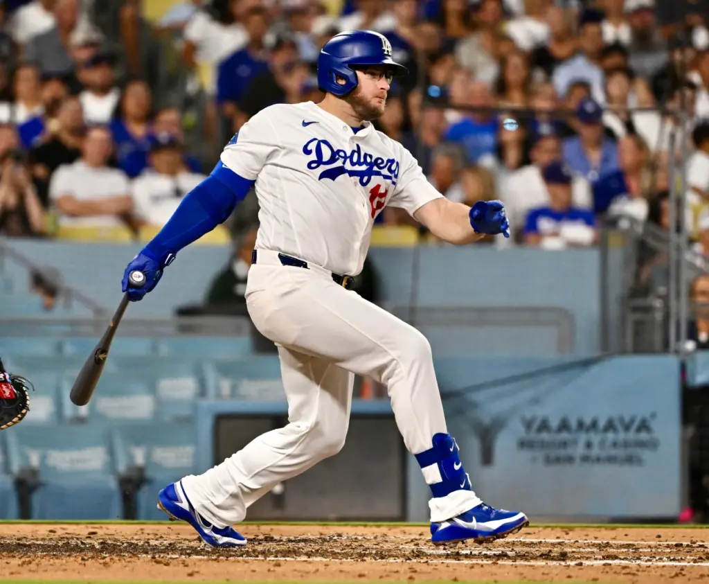 The Dodgers’ Max Muncy hits a single during the fourth...