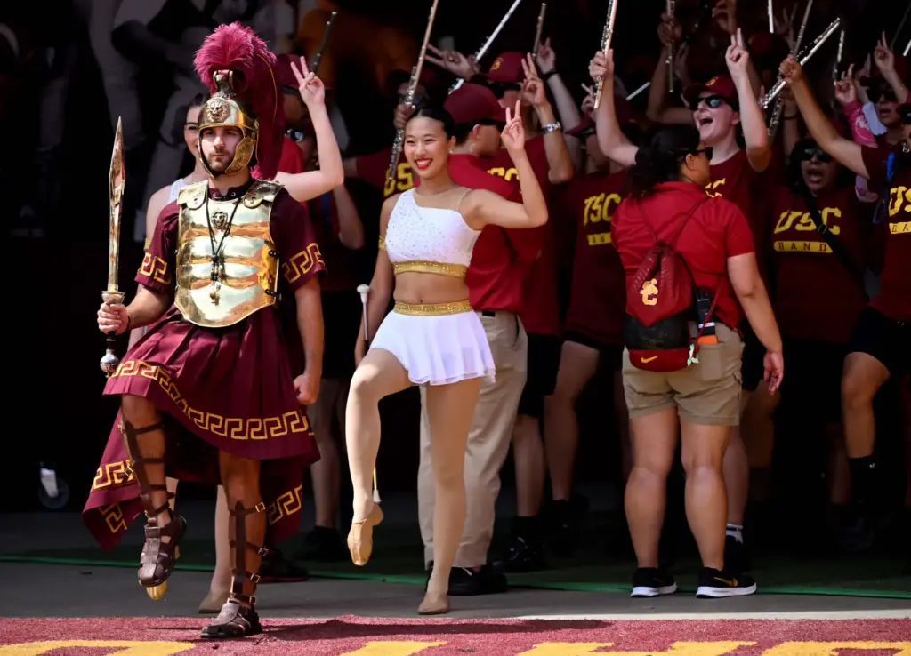 The USC Trojans bands walks onto the field prior to...