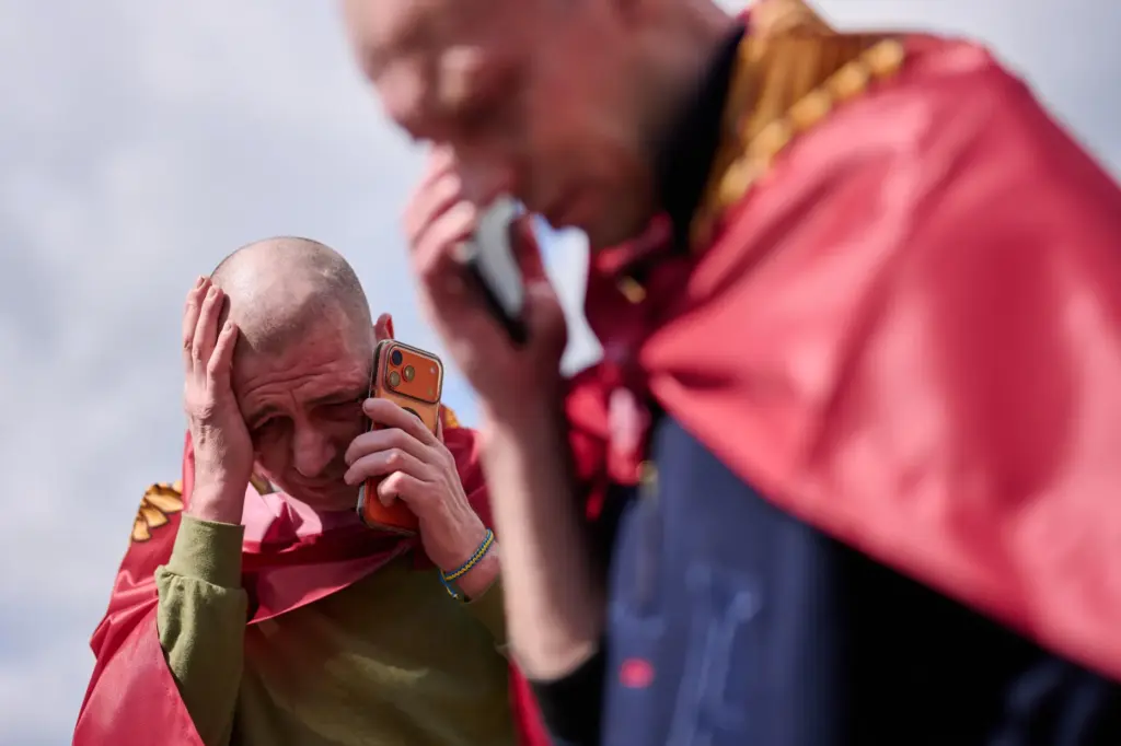 Ukrainian soldiers speak to their relatives after returning from captivity.