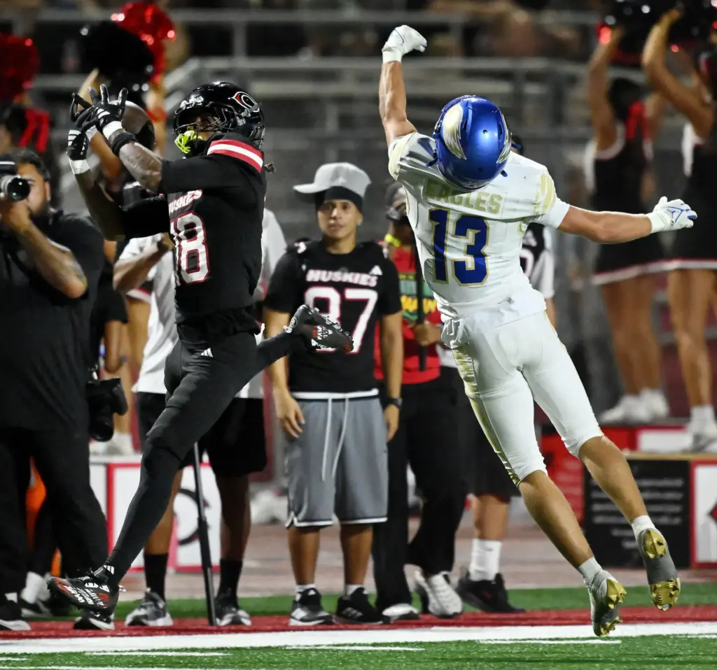 Centennial wide receiver Jaden Bynum (18) is unable to make...