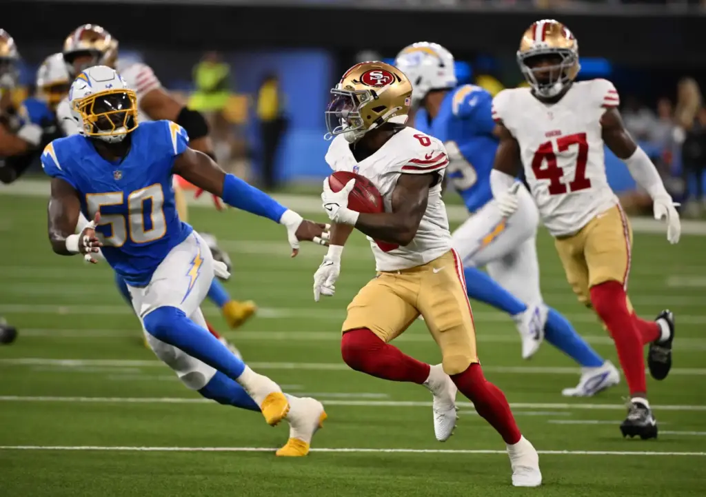 San Francisco 49ers safety Malik Mustapha returns a punt for...