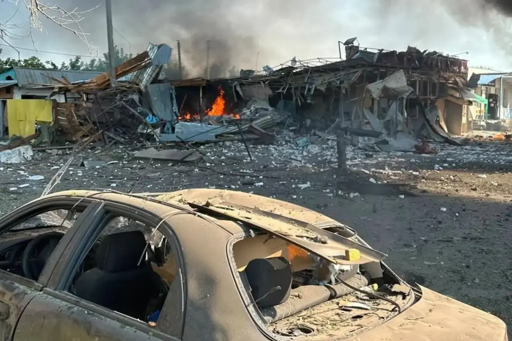 Fire is seen on the site of a Russian air attack in Pechenihy, Ukraine.
