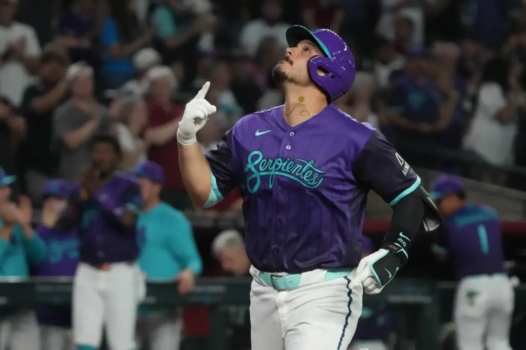 The Arizona Diamondbacks’ Nolan Arenado celebrates after hitting a solo...