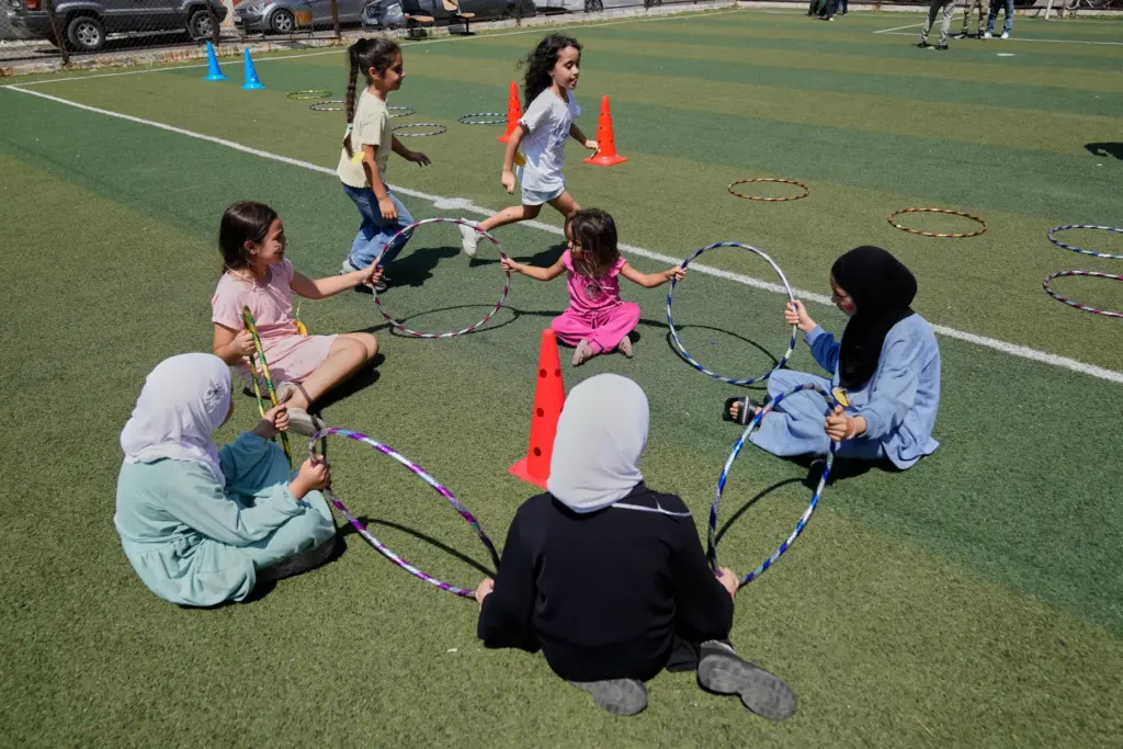 Displaced children play during an event organised by Save the...
