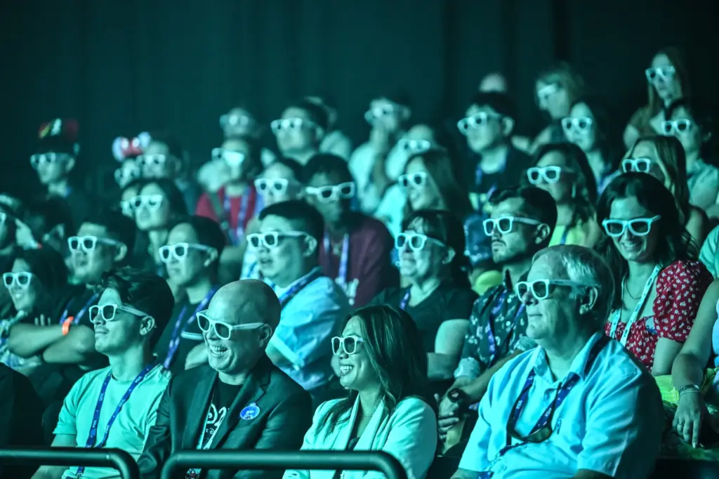 Visitors watch a 4D video in the Disney+ Hulu Theater...