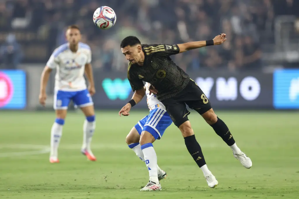 Los Angeles FC midfielder Mark Delgado, front, attempt to recover...