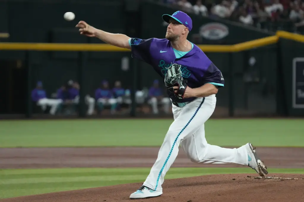 Arizona Diamondbacks starting pitcher Merrill Kelly throws to the plate...