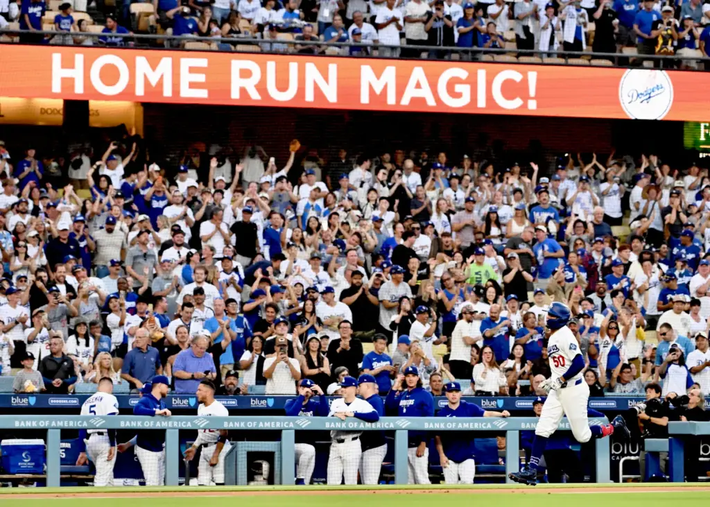 The Dodgers’ Mookie Betts runs the bases after hitting a...