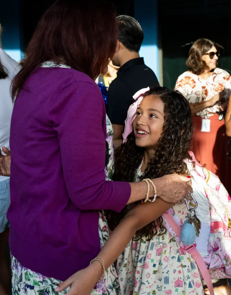Jaylene Garcia gets a hug as she walks through a...