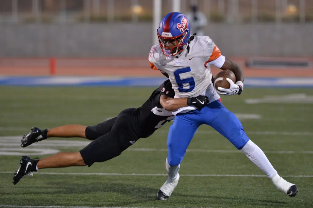 Serra back James Robinson shakes off Palos Verdes defender Travis...
