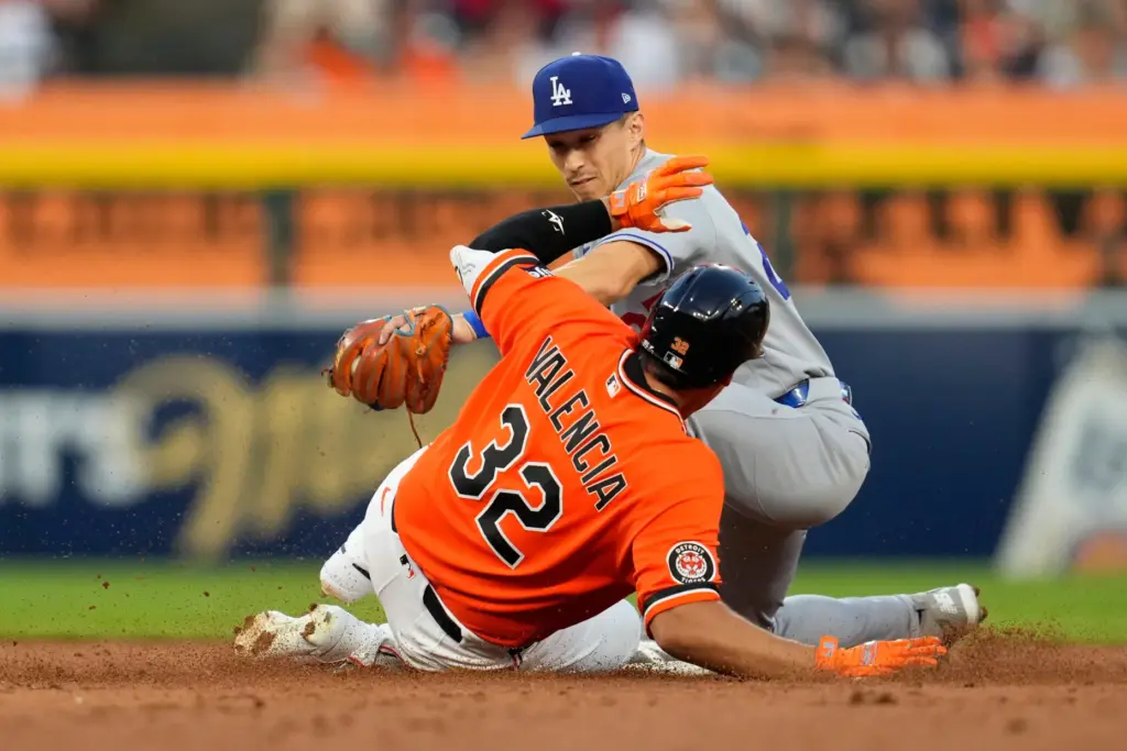 The Detroit Tigers’ Eduardo Valencia (32) slides safely into second...