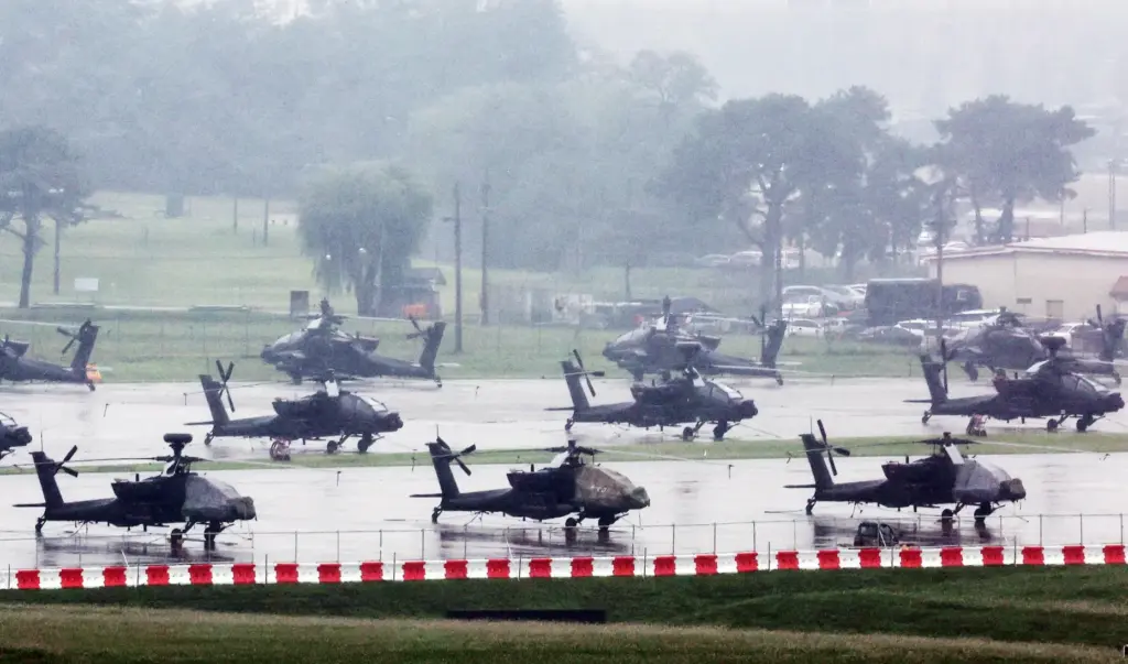 U.S. Apache helicopters are parked at Camp Humphreys in Pyeongtaek,...