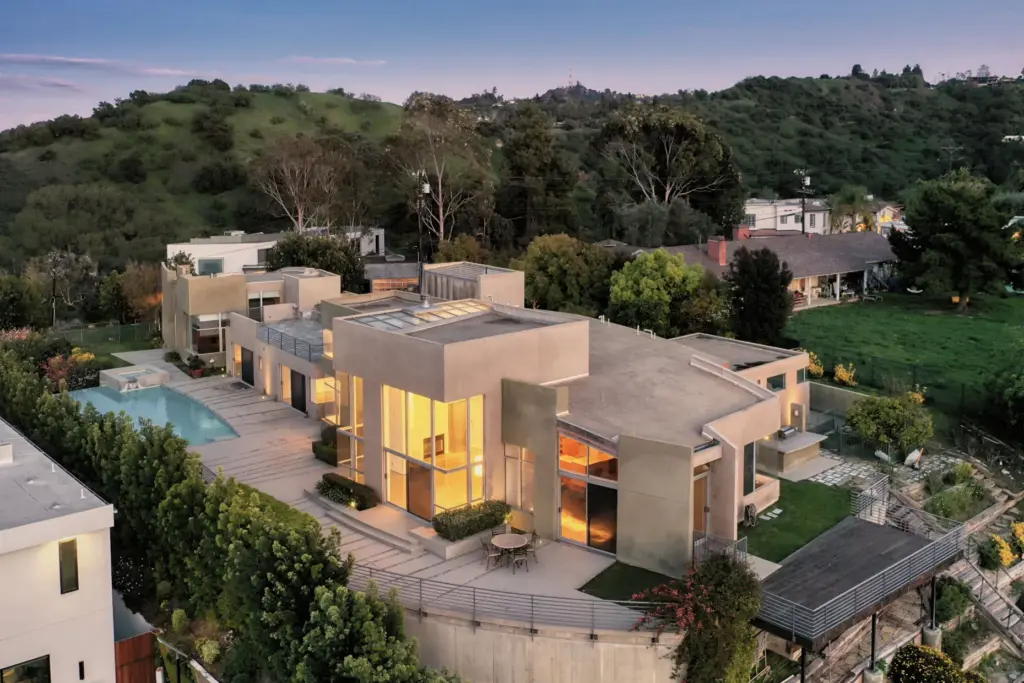 An aerial view of the concrete-and-glass residence on its nearly...
