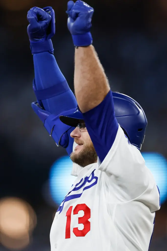 The Dodgers’ Max Muncy celebrates after hitting a three-run double...