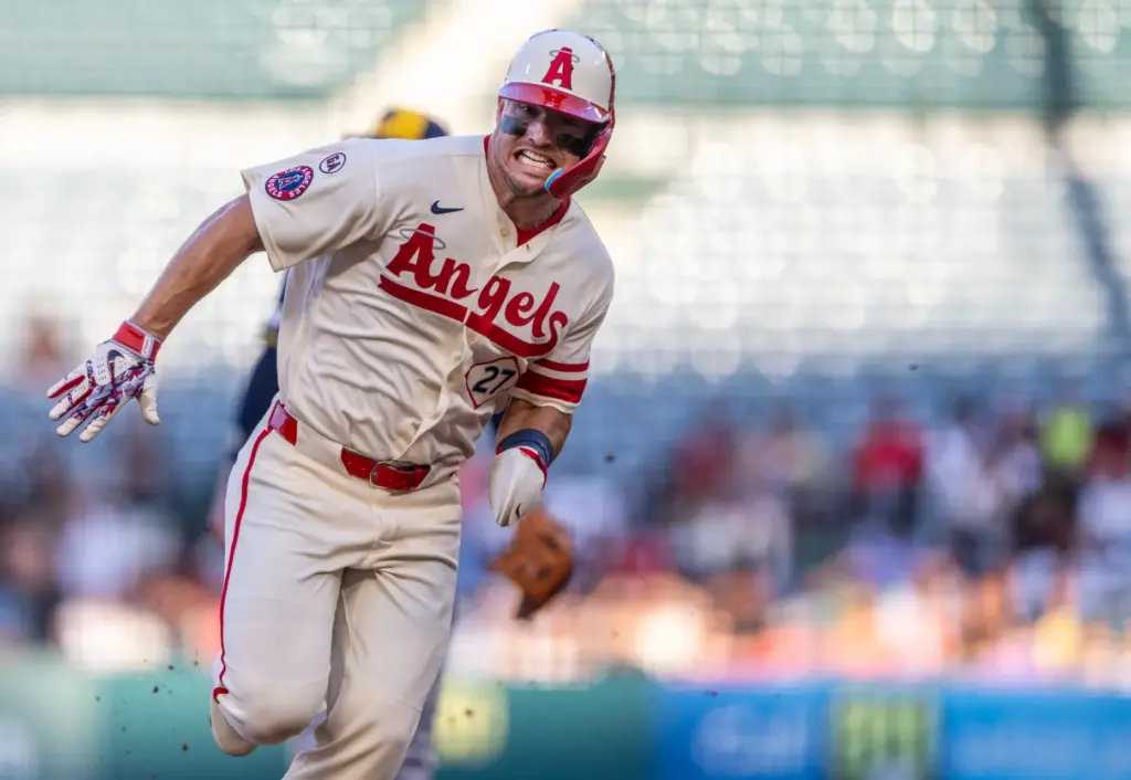 Angels center fielder Mike Trout (27) rounds third base on...