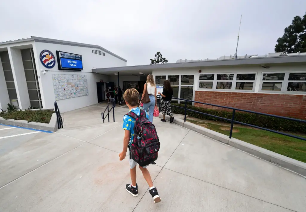 Students head to class during their first day at Harbor...