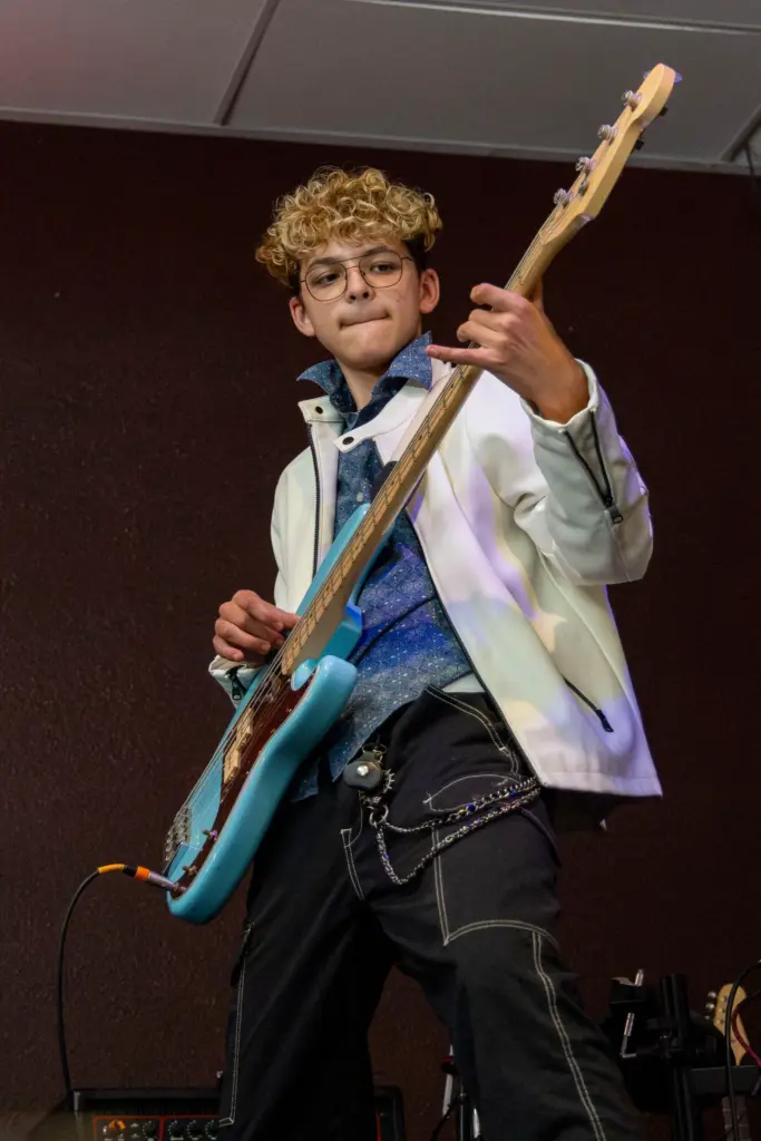 Jackson Stephen, 15, plays the bass during his performance on...
