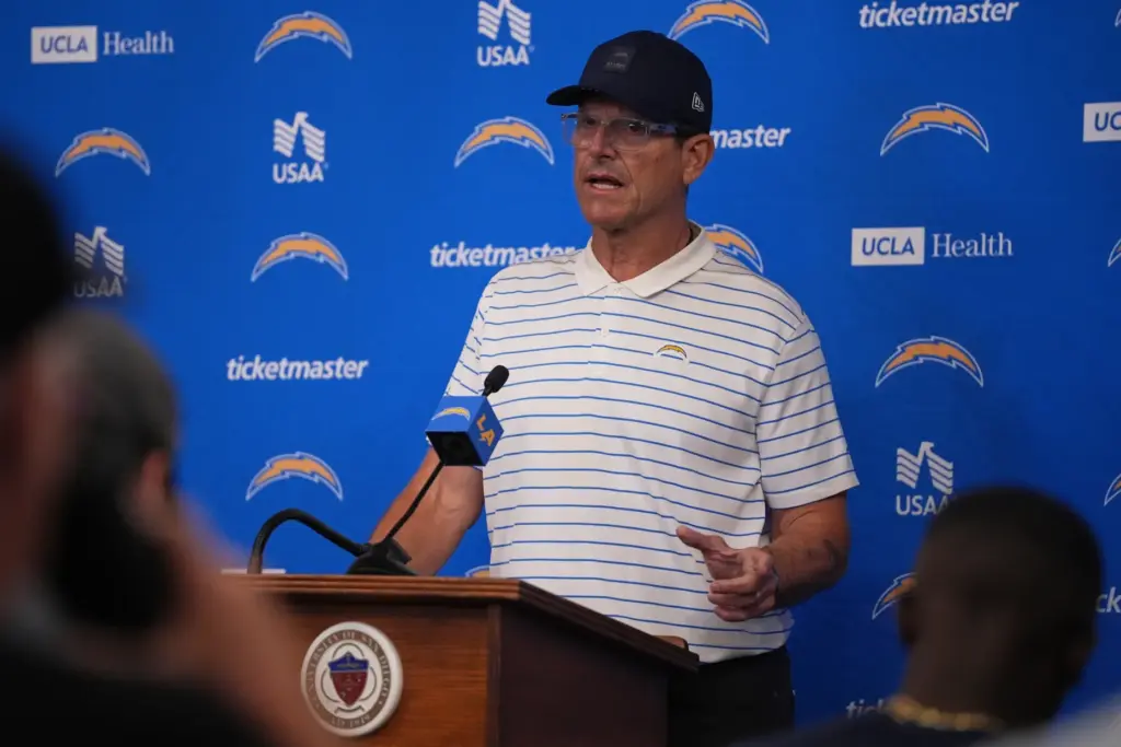Chargers head coach Jim Harbaugh speaks at a news conference...