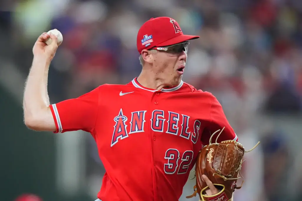 Angels starting pitcher Ryan Johnson throws during the first inning...