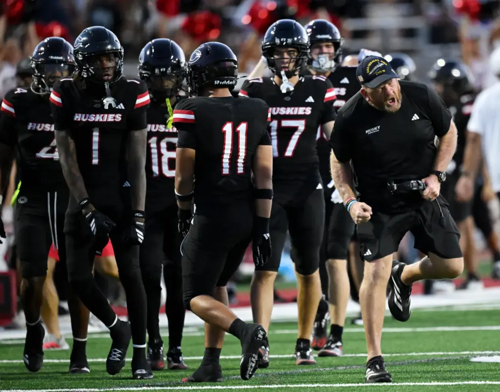 Centennial defensive coach Dan Herring celebrates their fourth down stop...