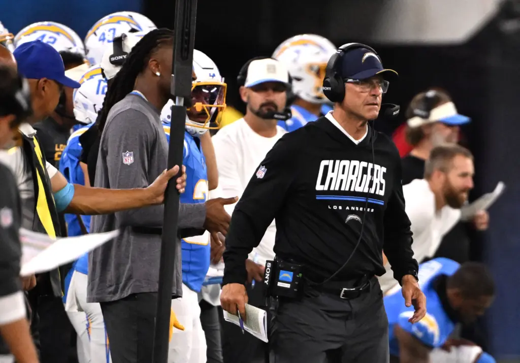Chargers head coach Jim Harbaugh looks on from the sideline...