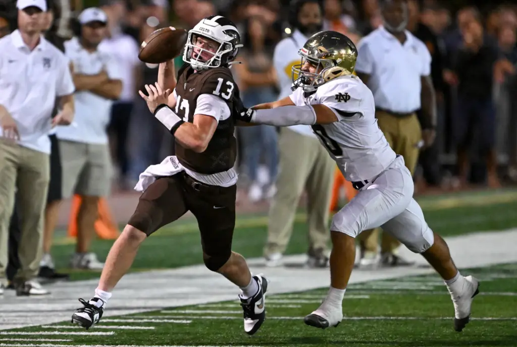 Crespiâs QB Chase Curren (13) gJudge Monroe (9) gets chased...