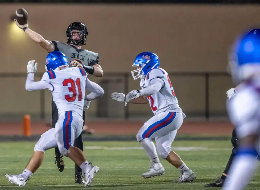 Huntington Beach quarterback Brady Edmunds (9) throws the ball during...