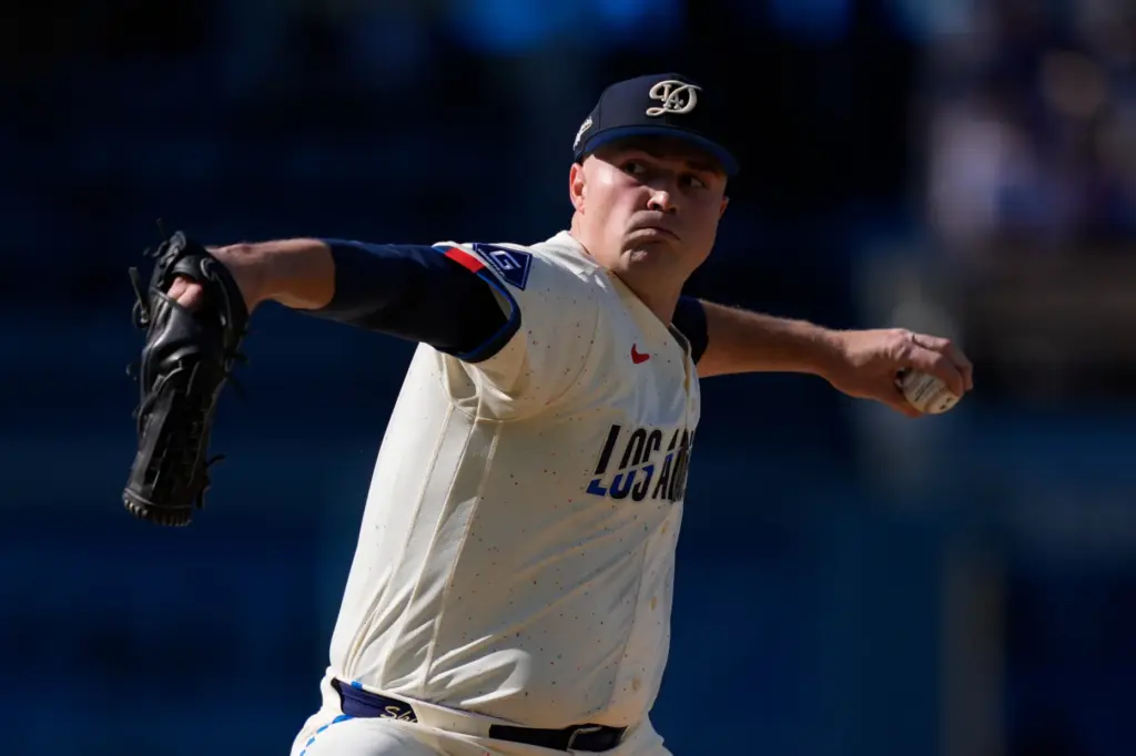 Dodgers starting pitcher Tarik Skubal throws to the plate during...