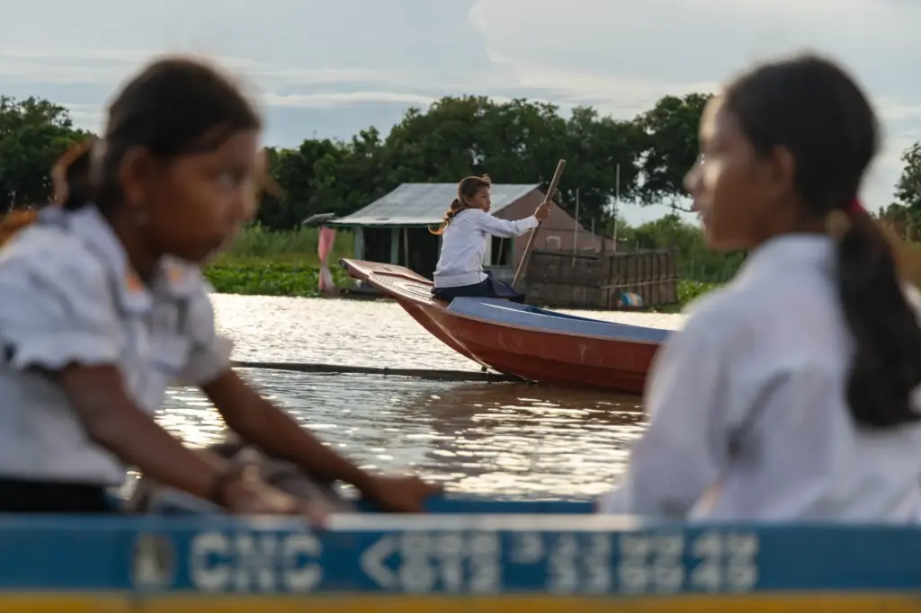 Students board school boats to return to their homes in...