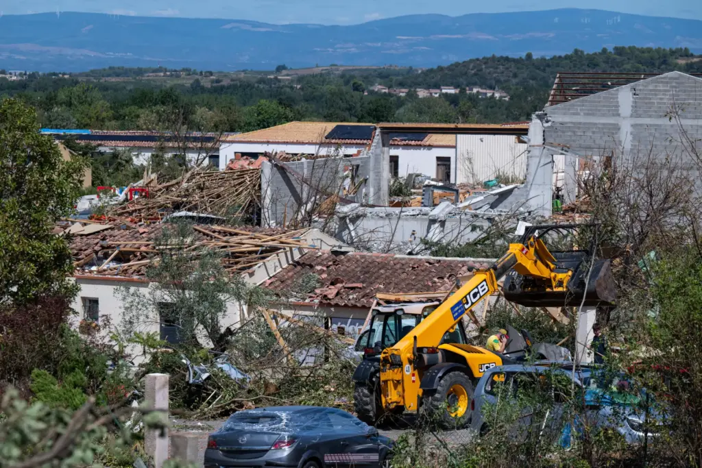 Damaged houses are pictured after a tornado ravaged the small...