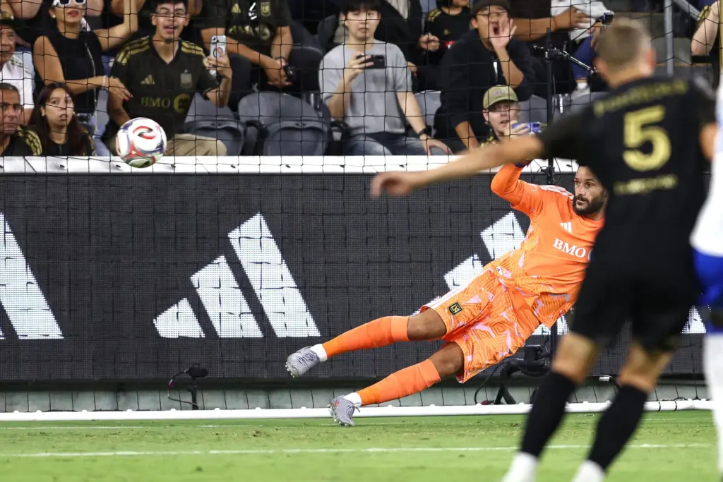 Los Angeles FC goalkeeper Hugo Lloris, bottom, goes the wrong...