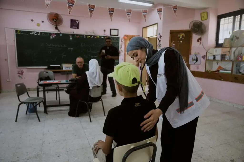 Palestinian patients receive treatment from medical staff with Physicians for Human Rights Israel.