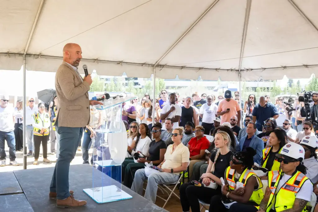 Mayor Chris Pimentel speaks during a topping-out ceremony for the...