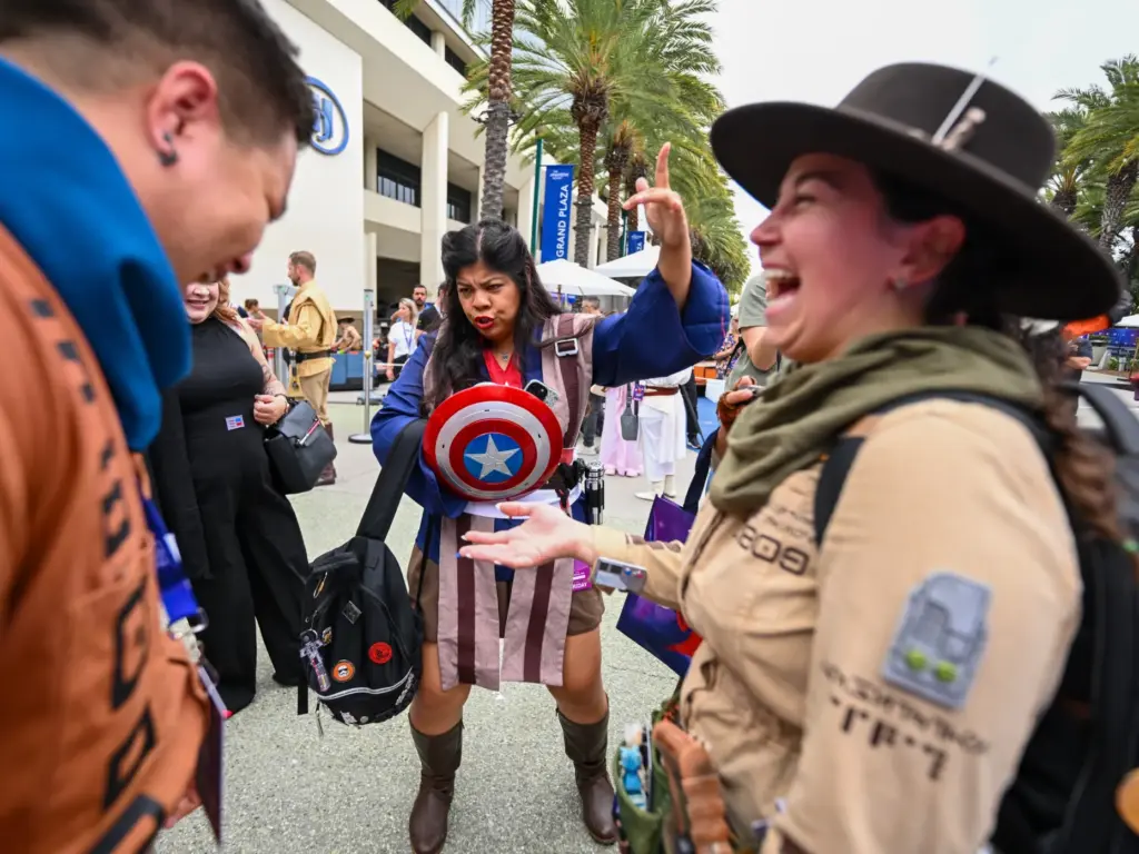 Britt Berin, dressed as a Captain America Jedi, center, dances...