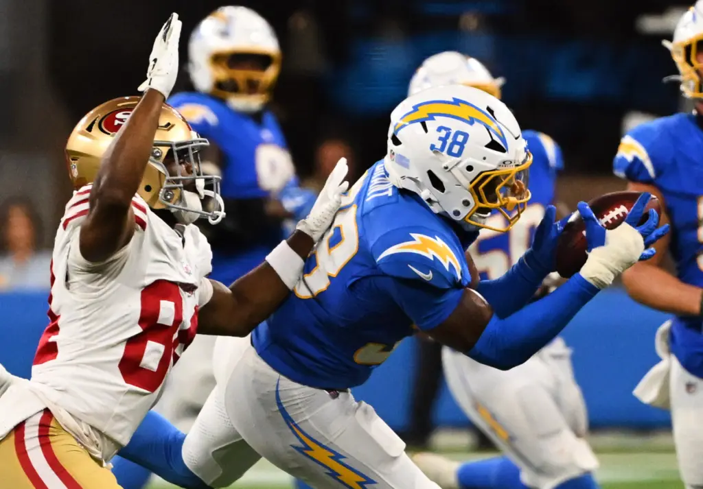 Chargers safety Devin Grant, right, intercepts a pass during the...