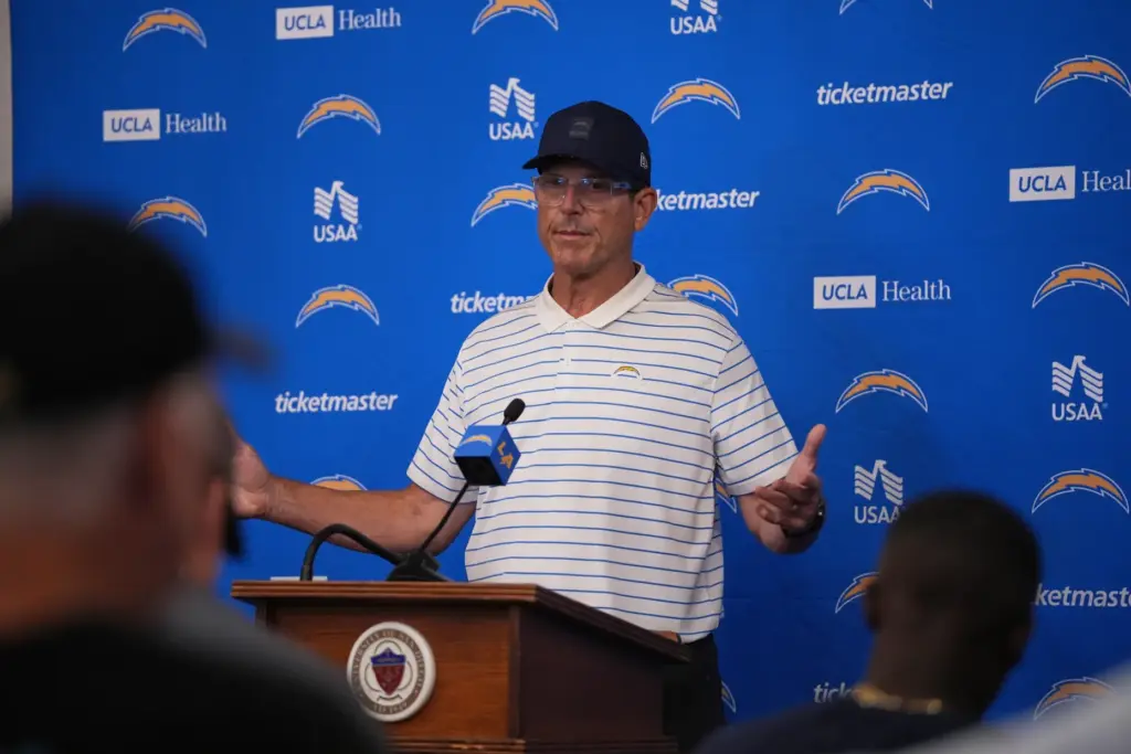 Chargers head coach Jim Harbaugh speaks at a news conference...