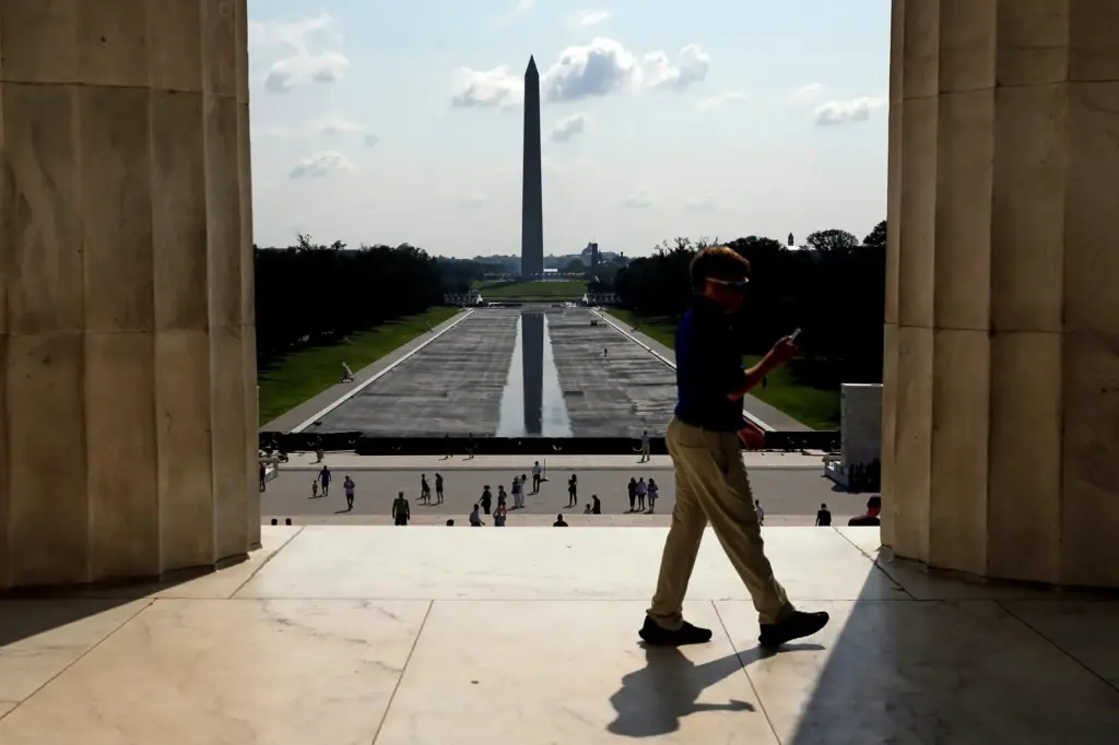 The Washington Monument is seen in the background of the...