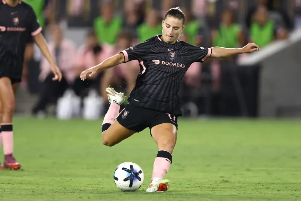 Angel City FC midfielder Ally Sentnor winds up to kick...