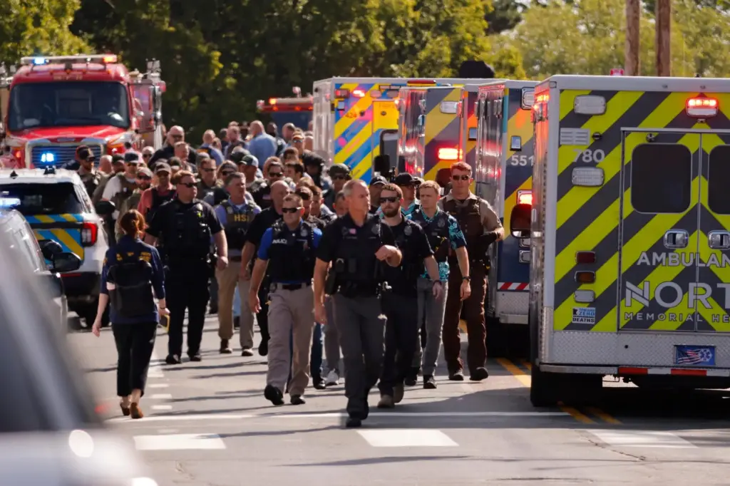 FILE – Law enforcement officers gather outside the Annunciation Church’s...