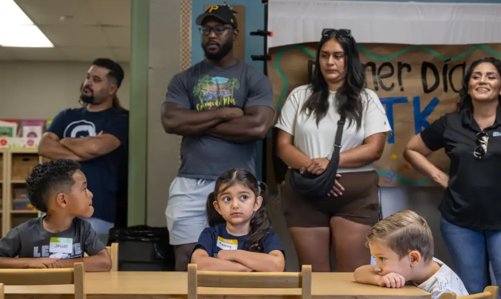 Parents take part in a first-day-of-school orientation in teacher Anna...
