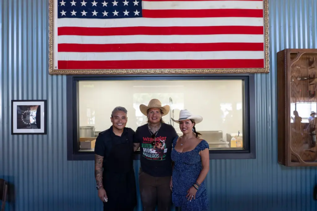 Executive chef Nick Echaore poses with co-owners Daniel and Brenda...