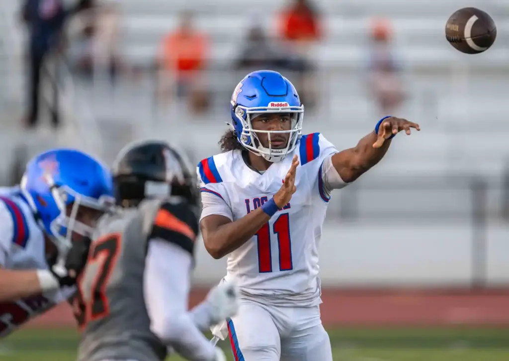 Los Alamitos quarterback Elijah McDaniel (11) throws the ball during...