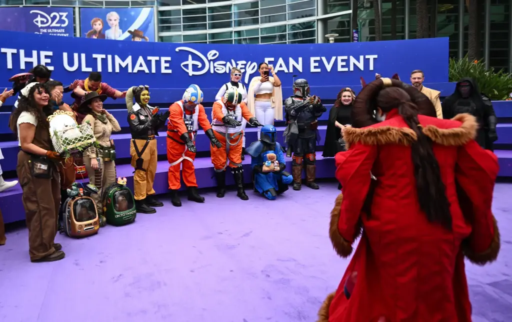 Fellow Star Wars cosplayers bow as Rachel Ibarra, dressed as...