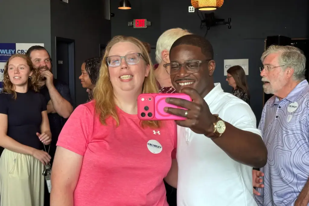 David Crowley, Democratic candidate for Wisconsin governor, takes a selfie...
