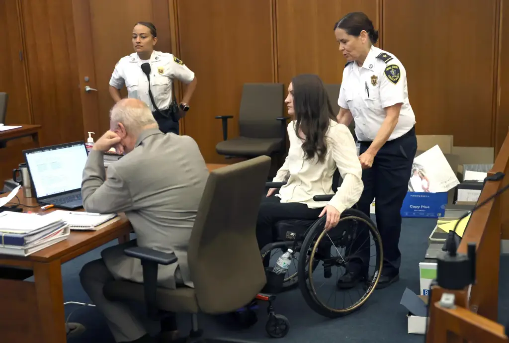 Lindsay Clancy enters the courtroom after a short break in...