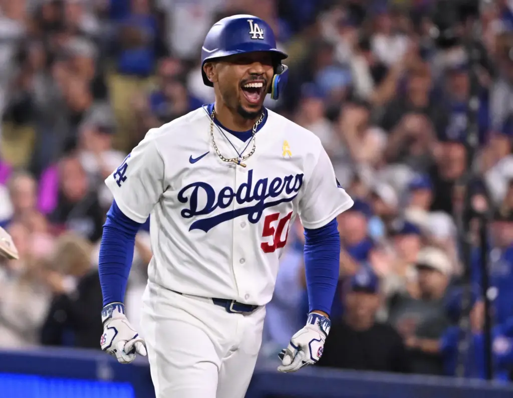 Dodgers shortstop Mookie Betts celebrates hitting a three-run home run...