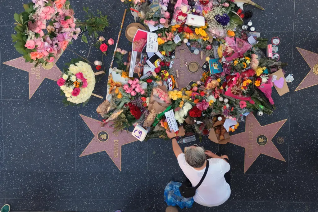Notes and photos are left on Dolly Parton's star on the Hollywood Walk of Fame.