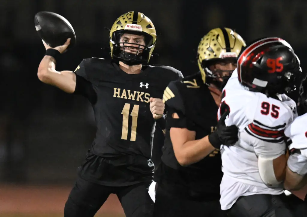 Hudson Shaddow #11 of El Dorado passes in the first...