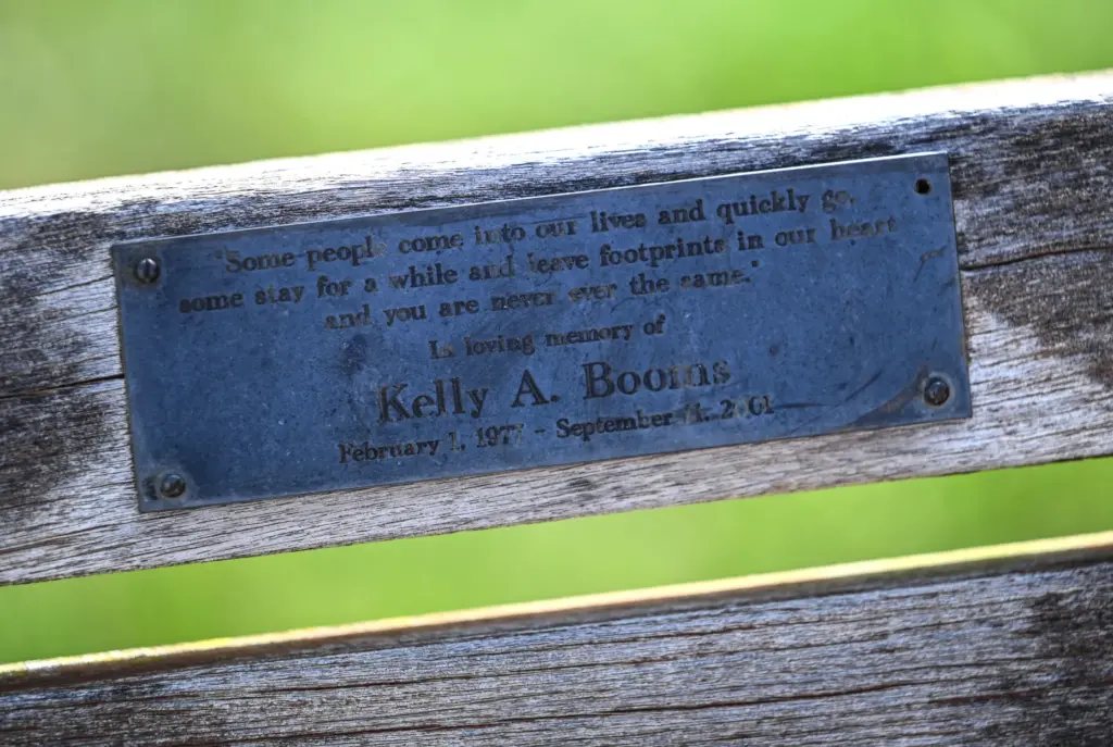 A plaque on a bench at Miami University memorializes Kelly...