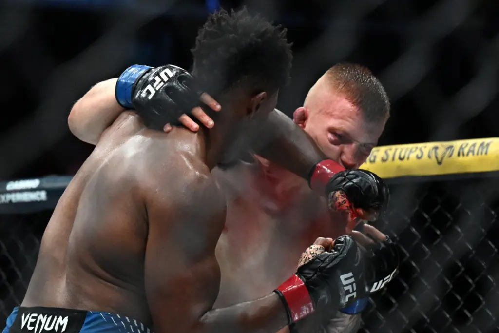 Alonzo Menifield (red) vs. Iwo Baraniewski (blue) during their fight...